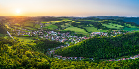 Aerial Panorama of Dolní loučky village in the south Moravia, Czech Republic with stunning spring colors and beautiful river during sunset