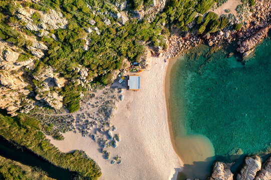 Wild beach drone aerial top view with turquoise water