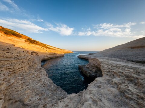 White rock sea cliffs landscape of Su Riu de Sa Ide in Sardinia, Italy