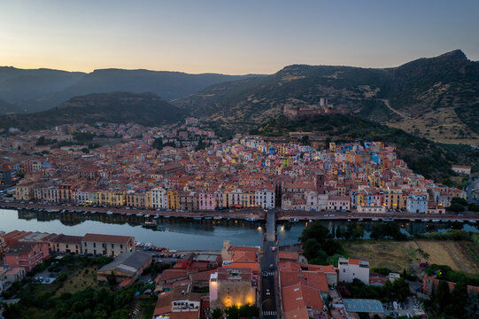 Bosa colorful city aerial drone view with castle on the top, Sardinia