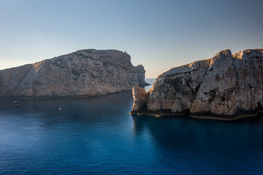 Capo Caccia and Foradada island drone aerial view in Sardinia, Italy