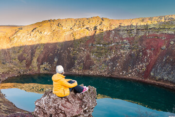 Contemplative solitude overlooking volcanic Kerid crater lake