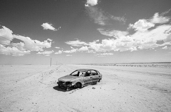 destroyed derelict burned out car in middle of desert, Namibia