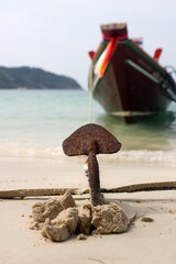 Junk at anchor. The anchor has sunk into the beach sand, the has sailed and is waiting for the...