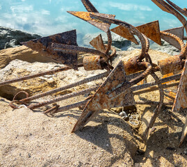 Anchors for fishing junks in winter at seaside. The fishing season is over