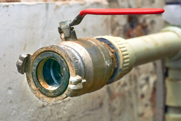 Plumbing. Sewerage. Water valve shutting off the water tap in the basement