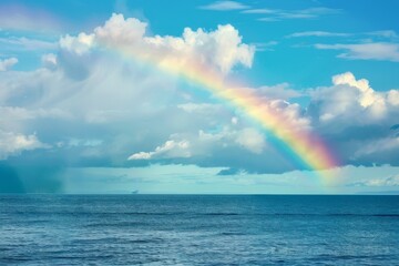 Bright rainbow over a calm ocean