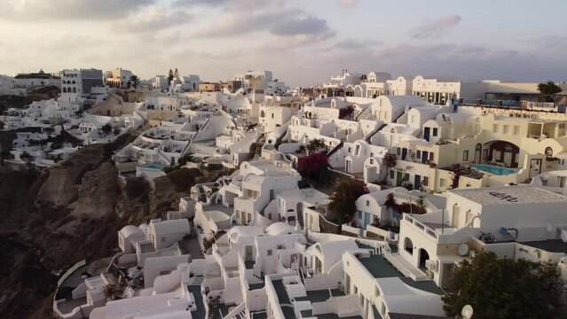 Santorini Greece, Oia At Sunset, White Buildings During Beautiful Evening Ocean Golden Hour.