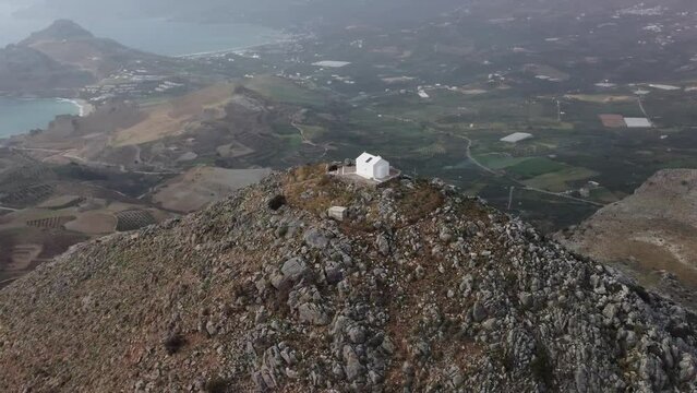 Panorama Mountain Top View: Slow Pan - Epic 360 Degree Viewpoint. Greek Island of Crete. Ekklisia Timios Stavros: Plakias, Greece on the South Coast of Kriti. 4K Aerial Drone Shot of Valleys and Sea.