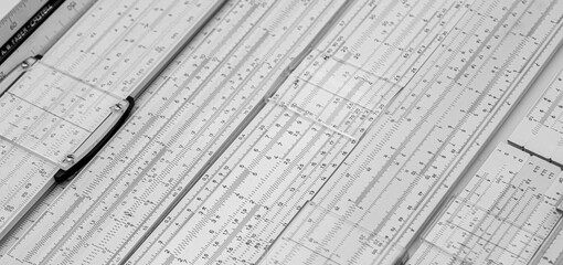 group of old slide rule slipstick analogue computer for mathematical calcululs - obrazy, fototapety, plakaty