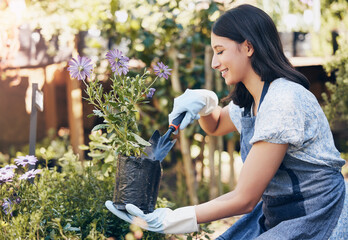 Woman, smile and plants with shovel for gardening at store in startup with passion for nature with...