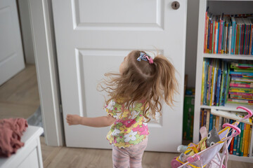 little girl having fun at home, movement and hair - obrazy, fototapety, plakaty