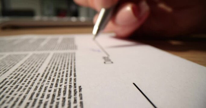 Contract document signed and dated by female businessman