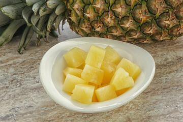 Marinated pineapple slices in the bowl