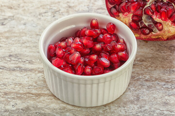Ripe red Pomegranate seeds in the bowl