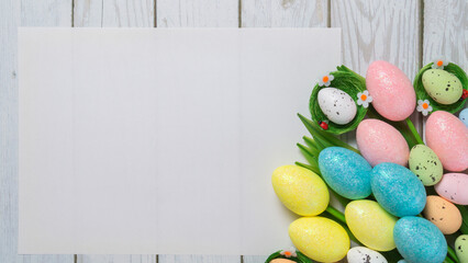 Creative easter flatlay with white paper blank	