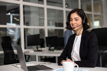 Woman professional helpline call center agent in wireless headset - 793699784