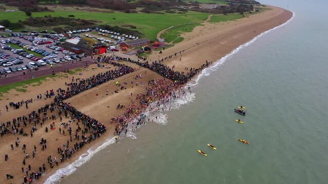 Aerial flying over Gosport New Years Day Swim UK 4K