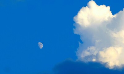 Moon and clouds in the daytime
