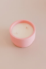 Candle in concrete form light background