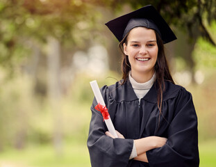 Graduation, diploma and portrait of university woman with arms crossed for education, achievement or success ceremony. Student, bokeh and person with certificate for satisfaction, happiness or event