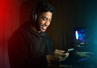 Gamer, man and happy with phone with in night, texting or reading for invitation link to rpg...