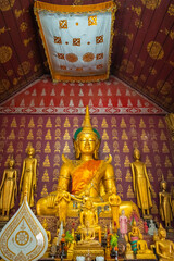 The gold Buddha statue at Wat Sop Sickharam in Luang Prabang, Laos