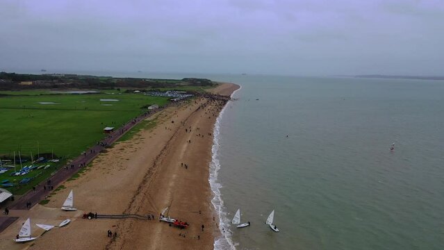 Aerial flying away Gosport New Years Day Swim UK 4K