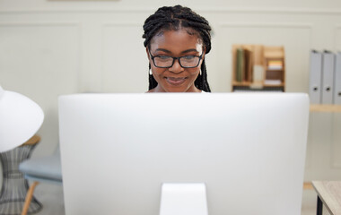 Happy, black woman and computer for research, searching and creative vision for writing project. African female person or copywriter with technology for planning article, news or story in office