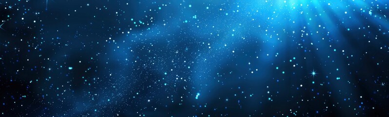 Abstract blue background with light rays and glowing particles