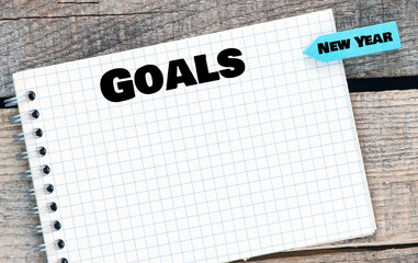 GOALS lettering written on notepad. Business concept.