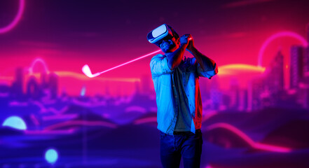 Caucasian man playing golf in metaverse while wearing VR goggles to enter simulated virtual world....