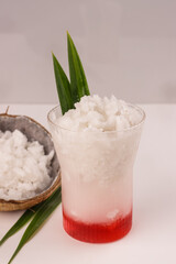 Obraz na płótnie Canvas Es Kelapa Kopyor. Iced Dessert Drink Made of Natural Coconut Curd and Pandan Syrup.