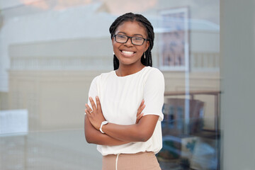 Businesswoman, portrait and office with arms crossed, smile and confidence for goals. Creative...