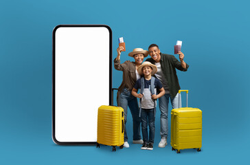 Family with passports by blank mobile phone screen