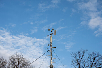 Weather station on the top of the hill in a summer Sunny day. An instrument for measuring the speed...