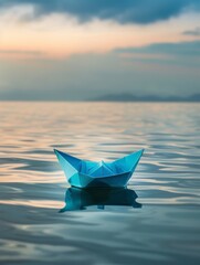 A calm blue origami boat gently floats on a lake as dawn breaks, reflecting the awakening sky.