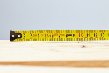 Yellow tape measure on the table