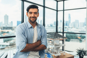 Portrait of architect engineer in casual outfit smile at camera while crossing arms. Businessman...