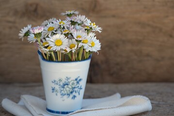 Daisies, with white petals and yellow centers, symbolize purity and simplicity. They adorn fields...