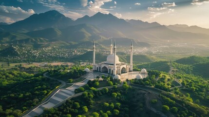 Aerial shot of Islamabad, the capital city of Pakistan showing the landmark Shah Faisal Mosque and the lush green mountains of Margala Hills - obrazy, fototapety, plakaty