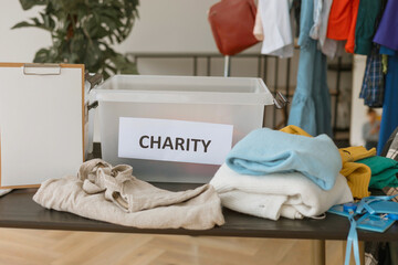 young people are engaged in charity and volunteering, selecting clothes for recycling and charity