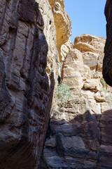 Jordan. Petra. Picturesque Siq Canyon. Narrow winding gorge with steep walls is road to main...
