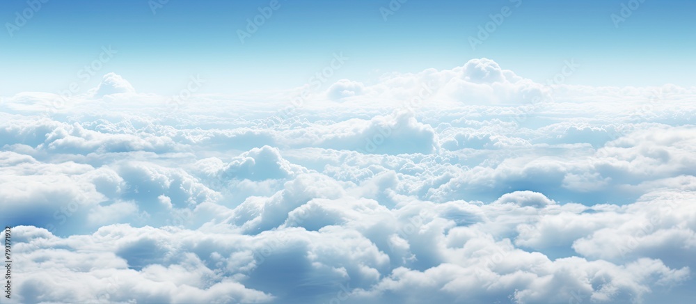 Poster A plane soaring in the vast blue sky with fluffy white clouds