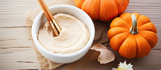 Pumpkins and a bowl of hummus with a spoon