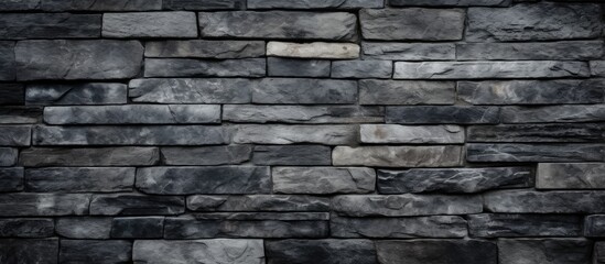 Obraz premium Close-up of a rugged stone wall against a dark backdrop