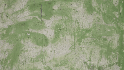 concrete wall and traces of green paint close-up