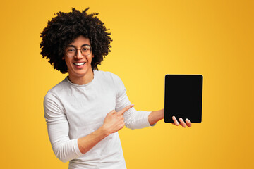 Cheerful african-american man showing cool modern digital tablet