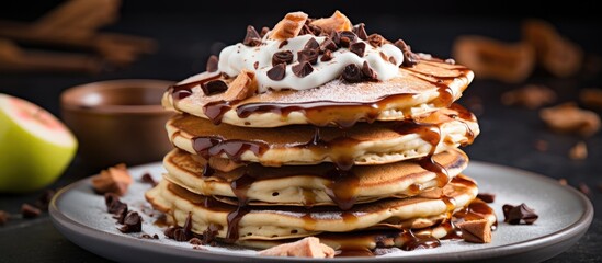 Pancakes with chocolate, whipped cream and caramel - obrazy, fototapety, plakaty