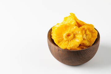 Dried pineapple in a bowl. Dried fruits. 